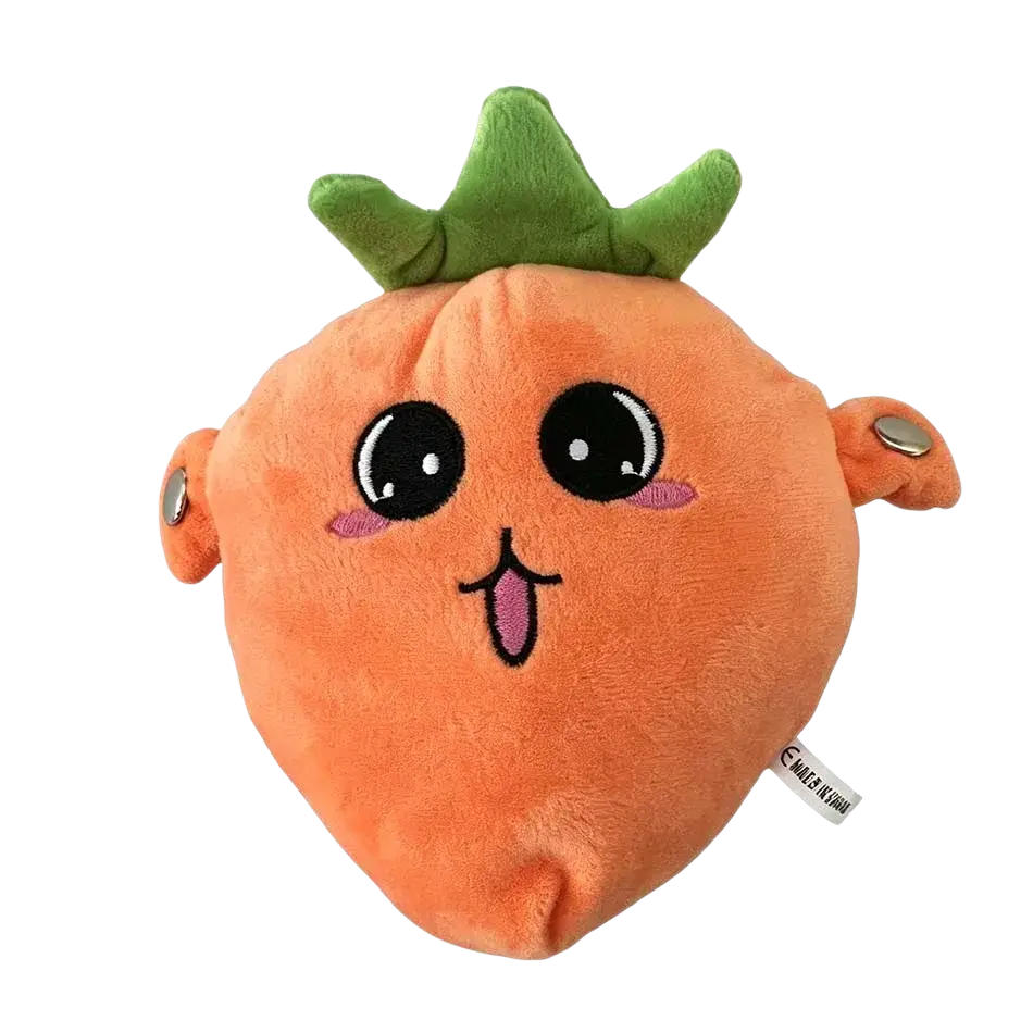 Orange plush carrot-shaped hand warmer with green leafy top and embroidered facial features in stuffed animal toy form