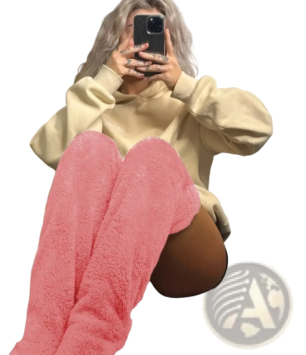 Pink plush knee high socks made of cashmere with a fuzzy texture for cozy leg warming use