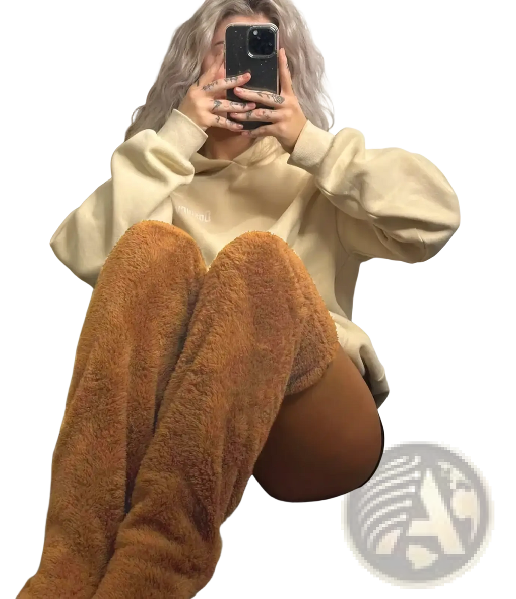 Tan fuzzy over-the-knee boots featuring plush cashmere material designed as knee high socks and fuzzy leg warmers
