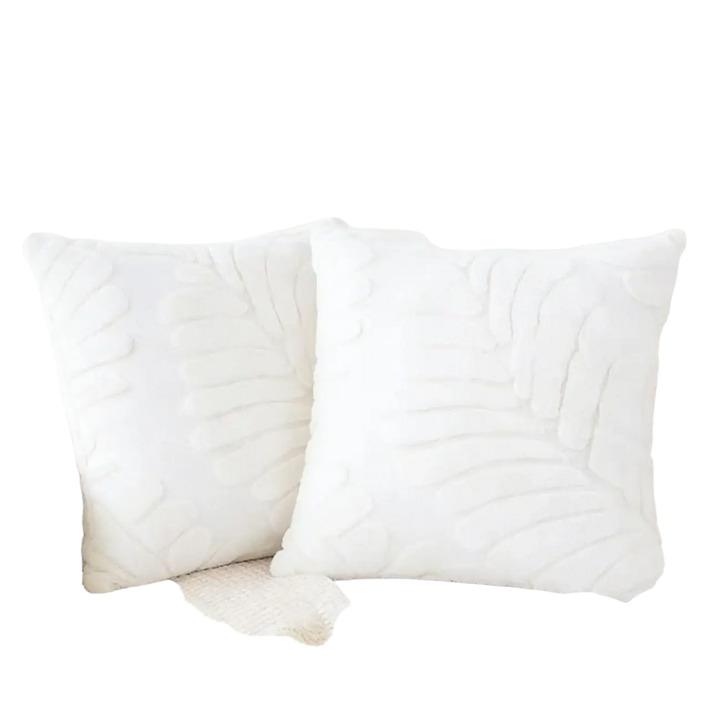 White plush throw pillow covers with raised leaf embroidery featuring soft fabric for elegant home decor
