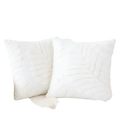 White plush throw pillow covers with raised leaf embroidery featuring soft fabric for elegant home decor
