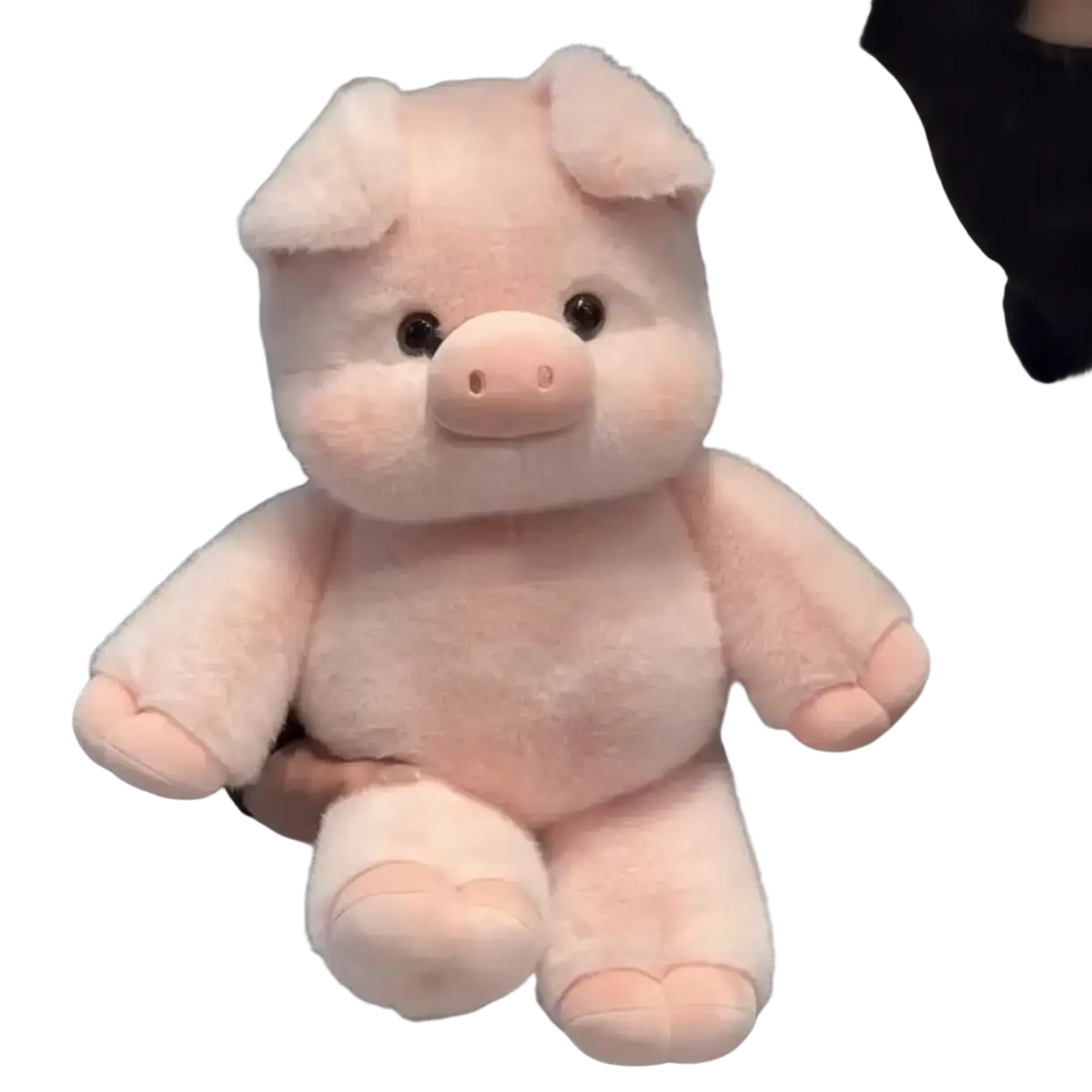 Plush pig stuffed animal pillow in soft blush pink with round black eyes and tiny pink nose measuring 17.7 inches