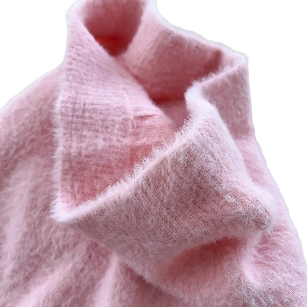 A soft fluffy pink turtleneck sweater with textured knit and fuzzy surface paired with plush pink cashmere thermal leggings