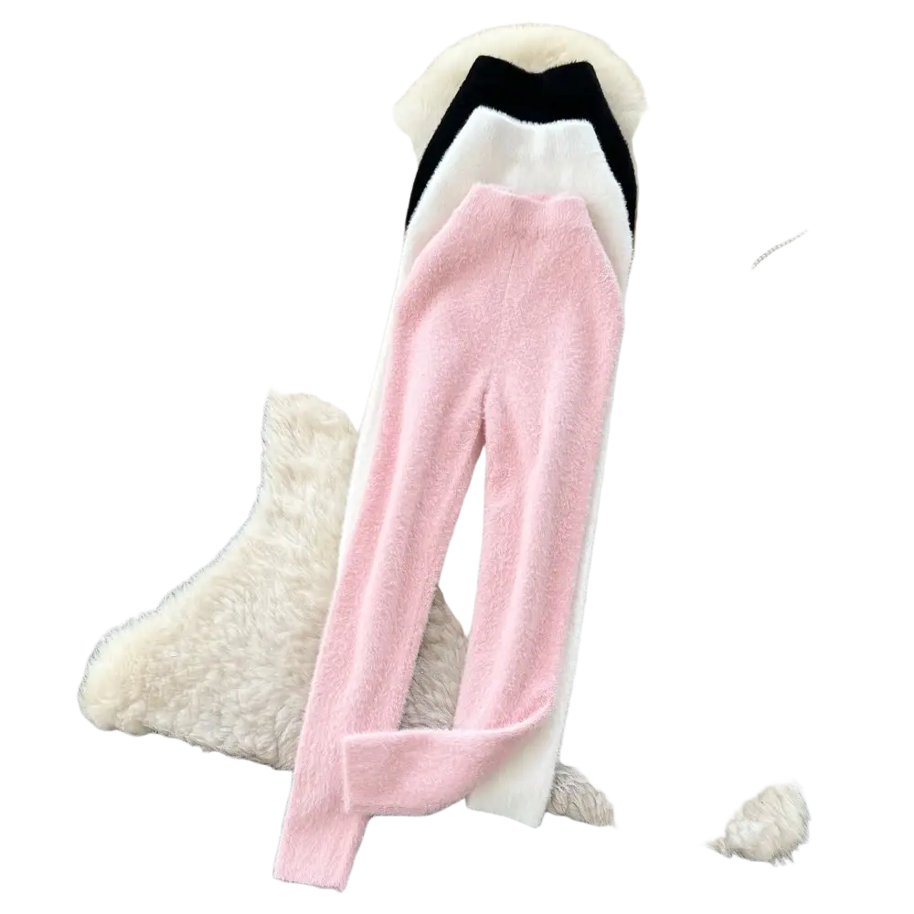 Plush pink cashmere thermal leggings featuring a soft pink and white knit high-waisted pant with ribbed waistband