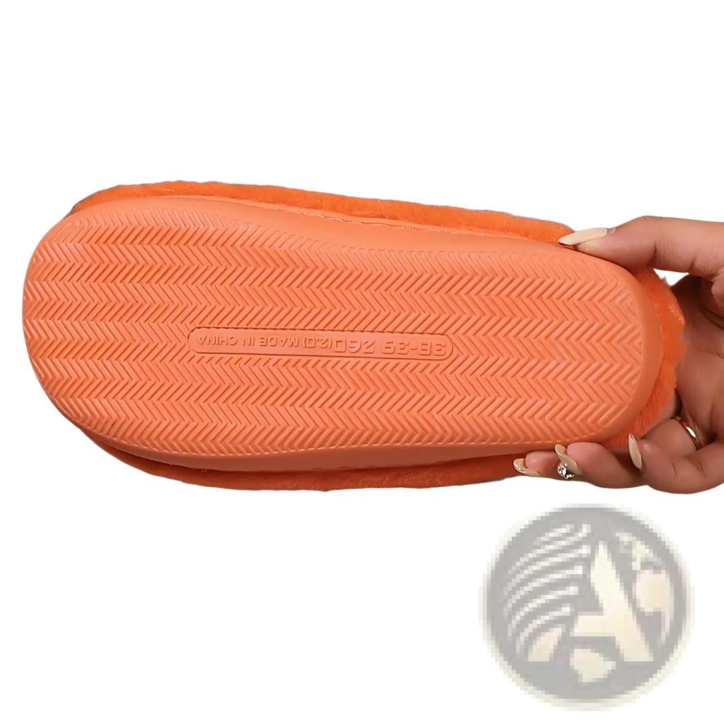 Orange plush pumpkin halloween indoor slipper with fuzzy material and textured rubber sole for comfortable wear