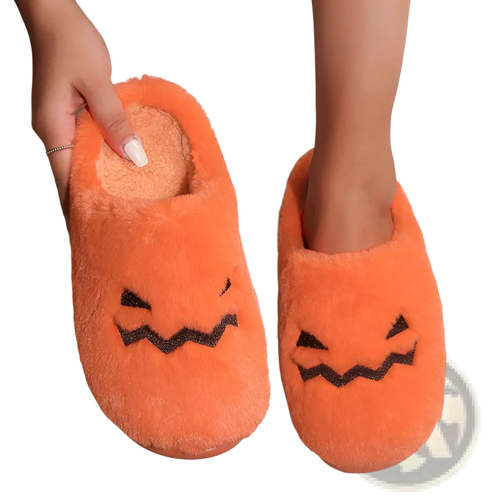 Plush pumpkin Halloween indoor slippers in orange with black embroidered facial features for cozy indoor use