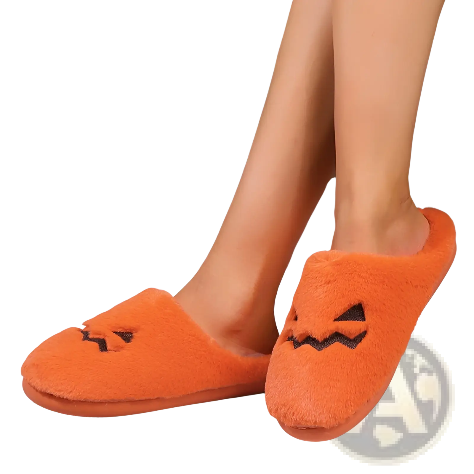 Plush pumpkin Halloween indoor slipper in orange with black embroidered facial features and soft material