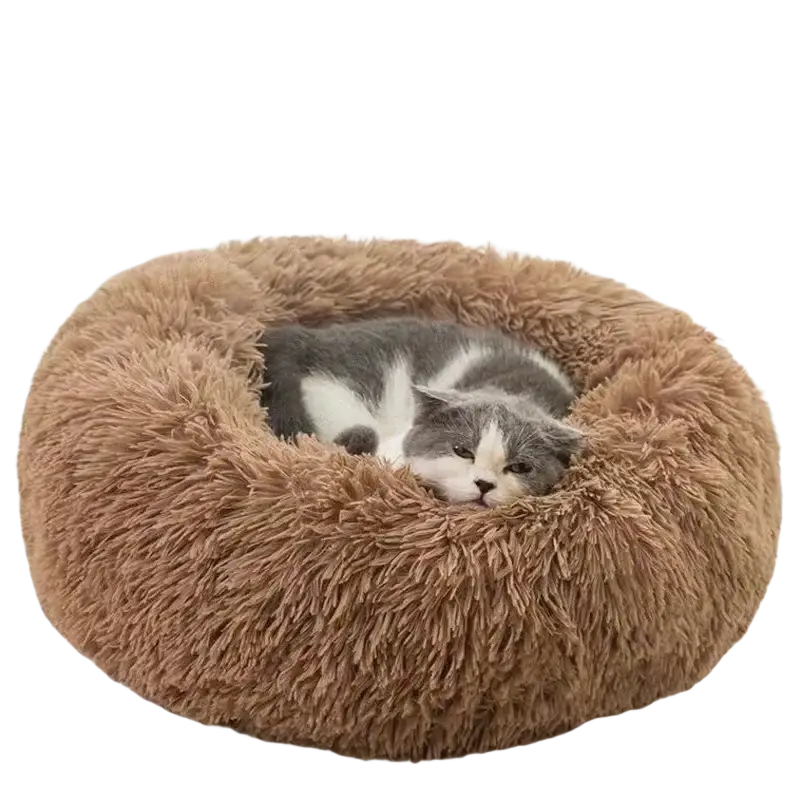 A plush round brown cat bed with soft shaggy texture cradling a gray and white cat for warm pet comfort
