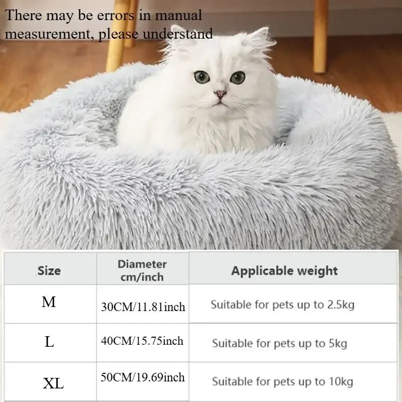 A fluffy light gray plush round cat bed with soft shaggy texture designed as a warm and comfortable pet nest