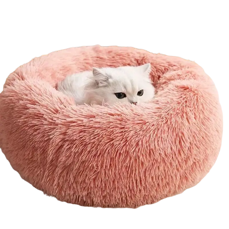 Pink fluffy circular pet bed with soft plush material features a white cat nestled inside for warmth and comfort