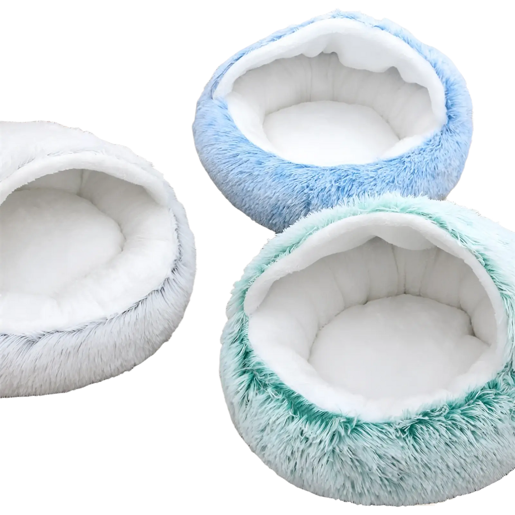 Plush round semi-enclosed cat bed with a fluffy blue exterior and soft white interior lining for pets