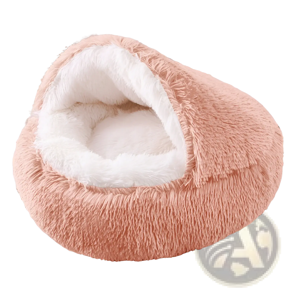 Plush round semi-enclosed cat bed in soft peach with a cozy white fur-lined interior for comfortable resting