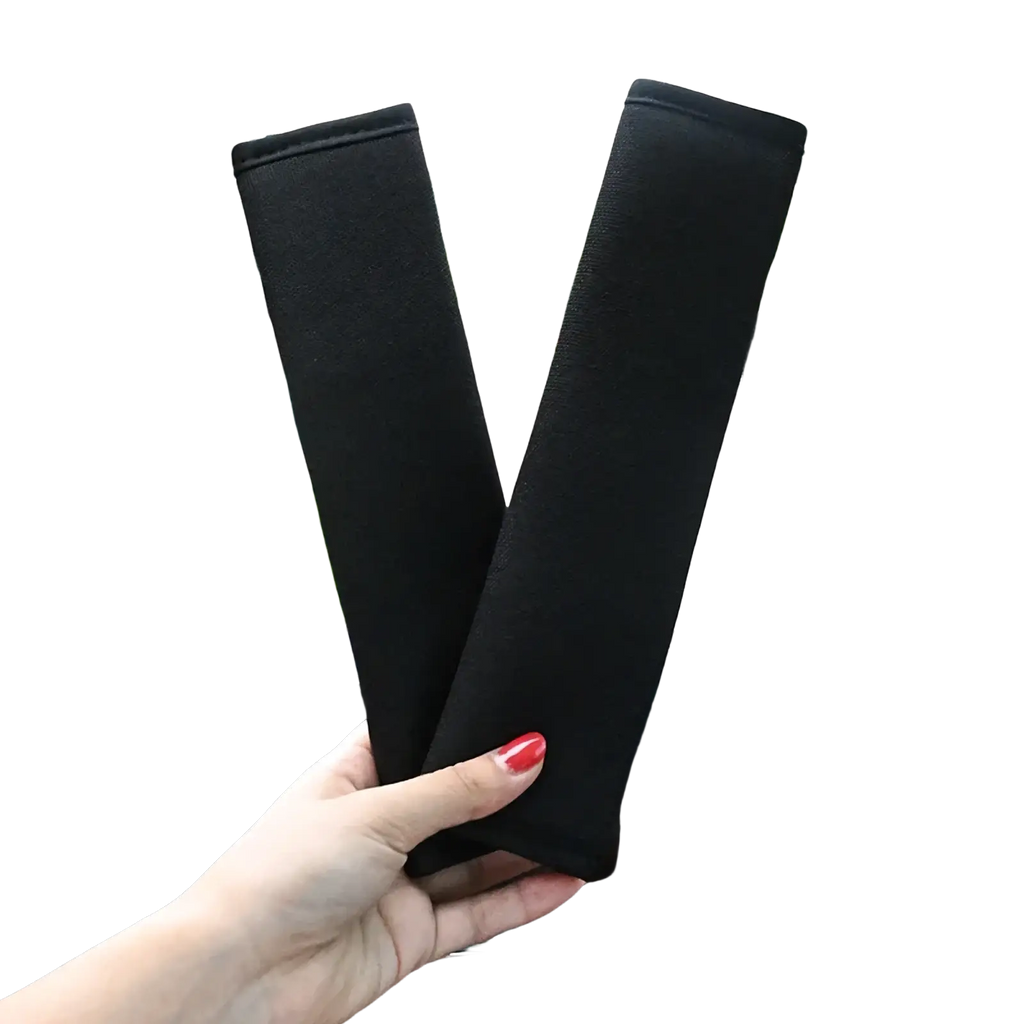 Black plush fabric car seat belt cover designed as a shoulder pad for car seat comfort and protection