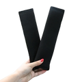 Black plush fabric car seat belt cover designed as a shoulder pad for car seat comfort and protection