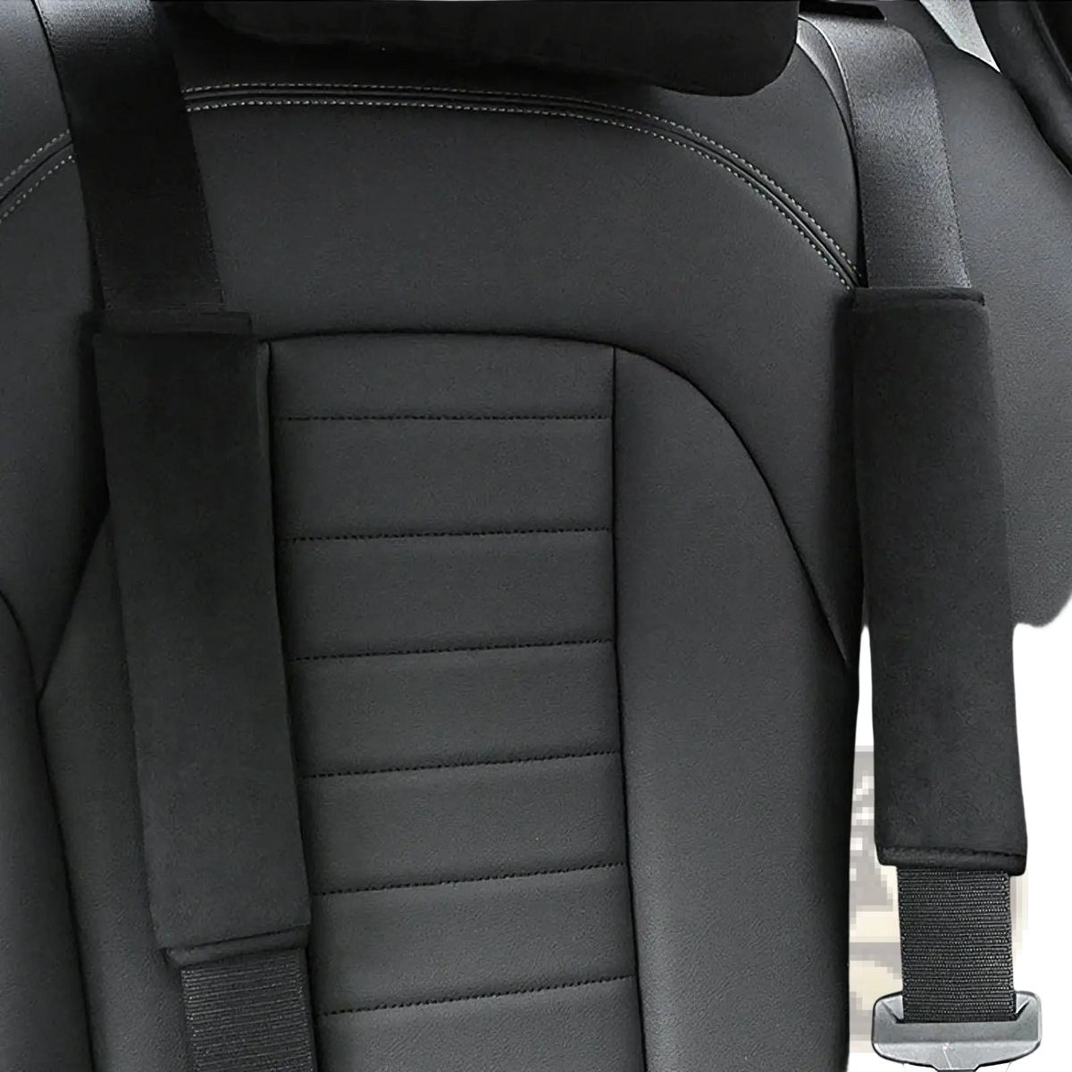 Black leather car seat with stitched detailing and plush black and pink padded seat belt shoulder covers