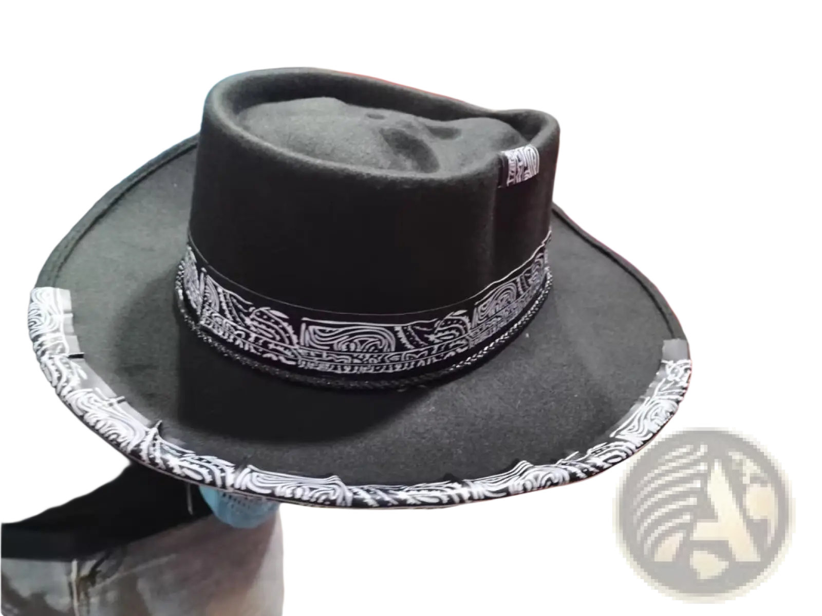 Plush skull cowboy hat in black felt with a wide brim and white patterned band around the crown