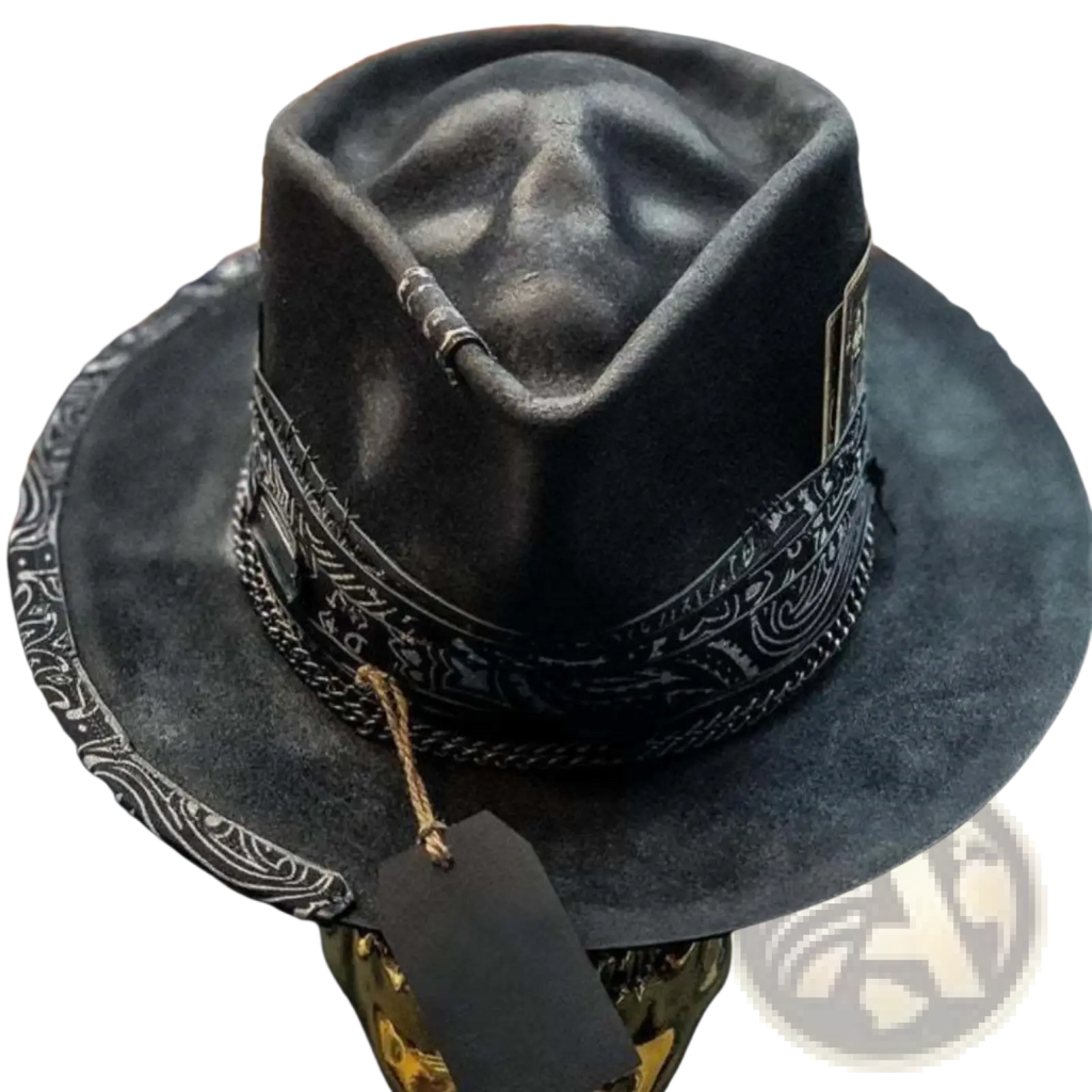 Plush skull cowboy hat in black suede with wide brim, white bandana-patterned trim, and metallic chain accents