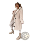 Beige plush teddy bear coat with black buttons made of faux fur ideal for tan winter outerwear