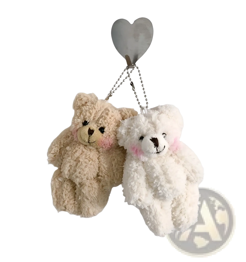 Plush teddy bear keychains in soft beige and white with embroidered facial features and silver chain links