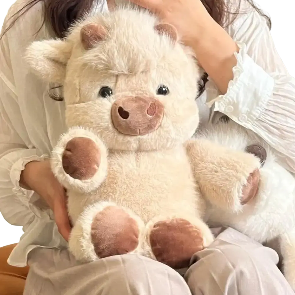 Plush toy stuffed animal cute calf in cream color with soft brown snout and paw pads featuring gentle black eyes