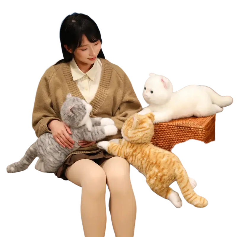 Soft plush toys featuring gray white and orange tabby stuffed kitten animals with embroidered eyes and stitched details