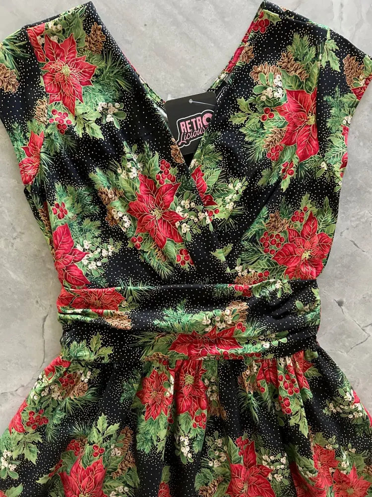 Poinsettia Greta vintage floral cotton midi dress with pockets in black featuring red poinsettias green pine branches and white berries