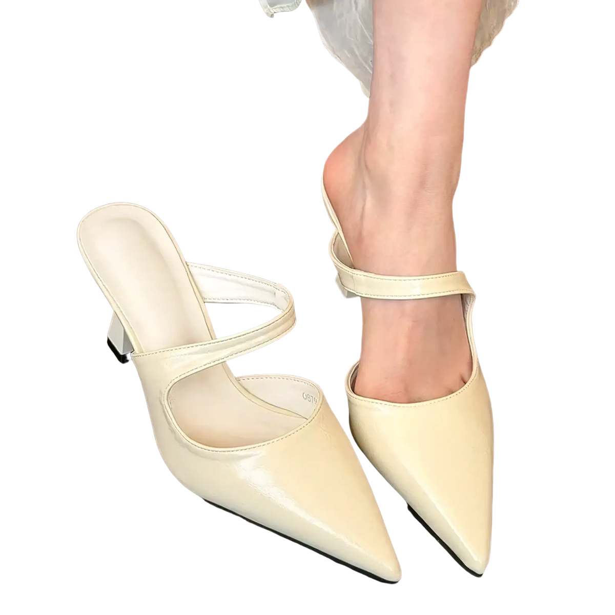Cream-colored patent leather mules with a pointed toe and thin ankle strap matching the pointed toe black leather mules title