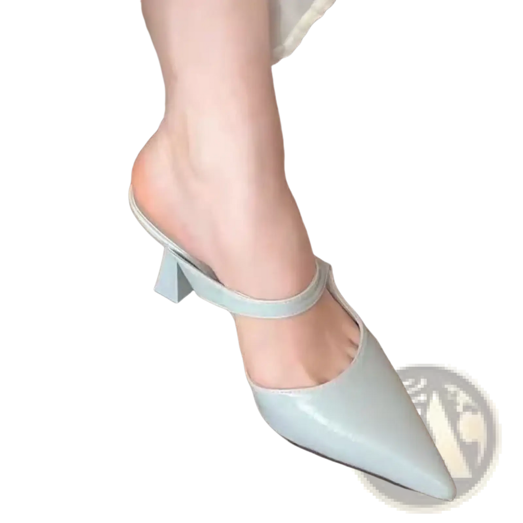 Light gray patent leather pointed toe mule heel with thin ankle strap and block heel in a pointed toe black leather mules style