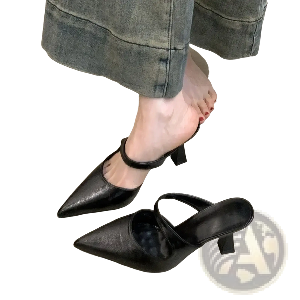 Pointed toe black leather mules with a glossy patent finish and ankle strap for elegant wear