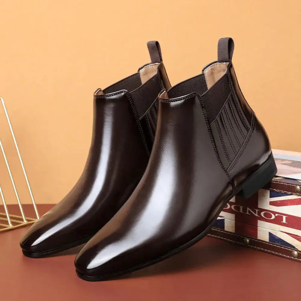 Men’s formal pointed toe leather Chelsea boots in polished black with elastic side panels for easy wear