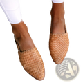 Tan woven leather pointed toe mules with buckle detail designed as flat mule sandals