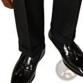 Polished genuine leather tassel loafers in black patent leather with a glossy finish and classic design
