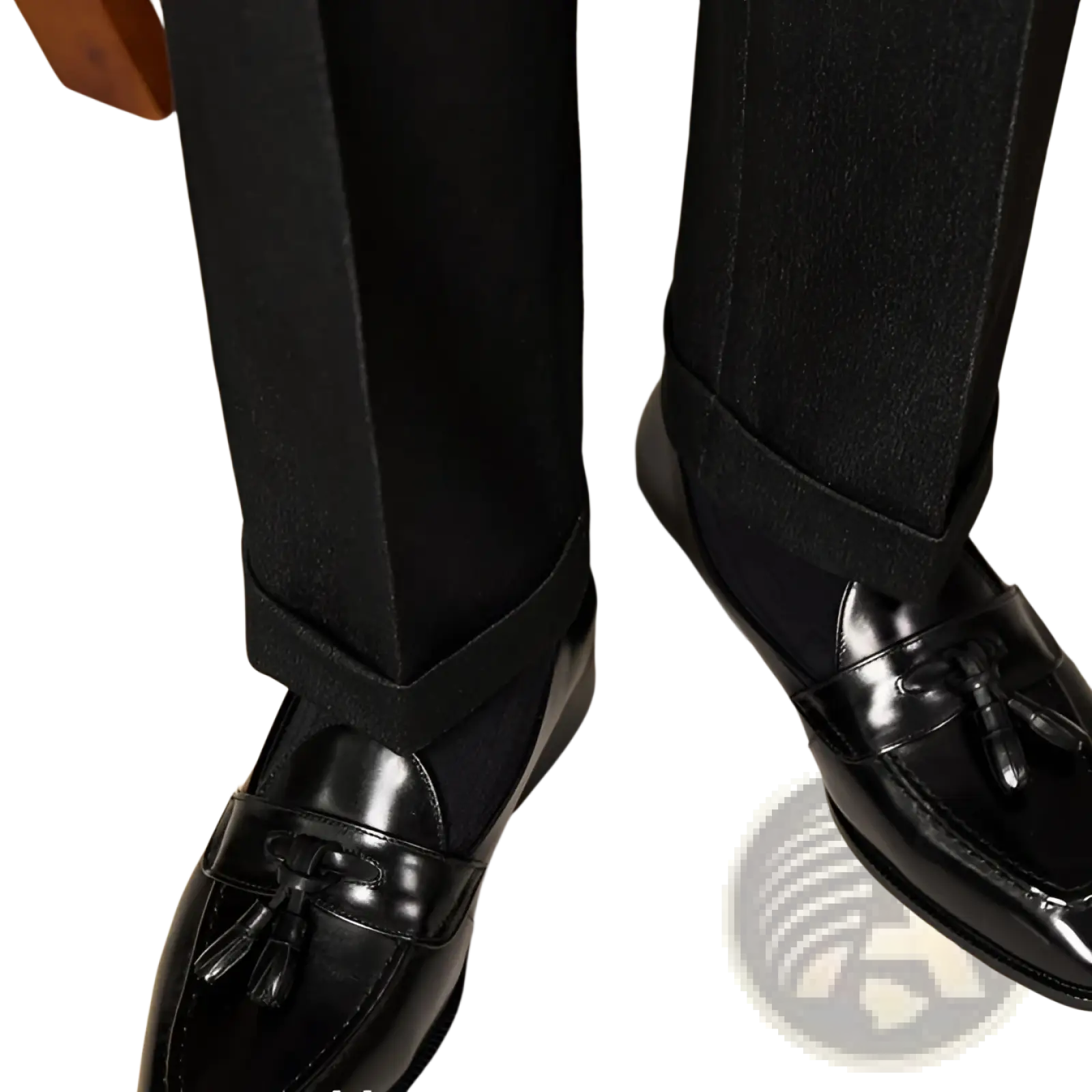 Polished genuine leather tassel loafers in black patent leather with a glossy finish and classic design