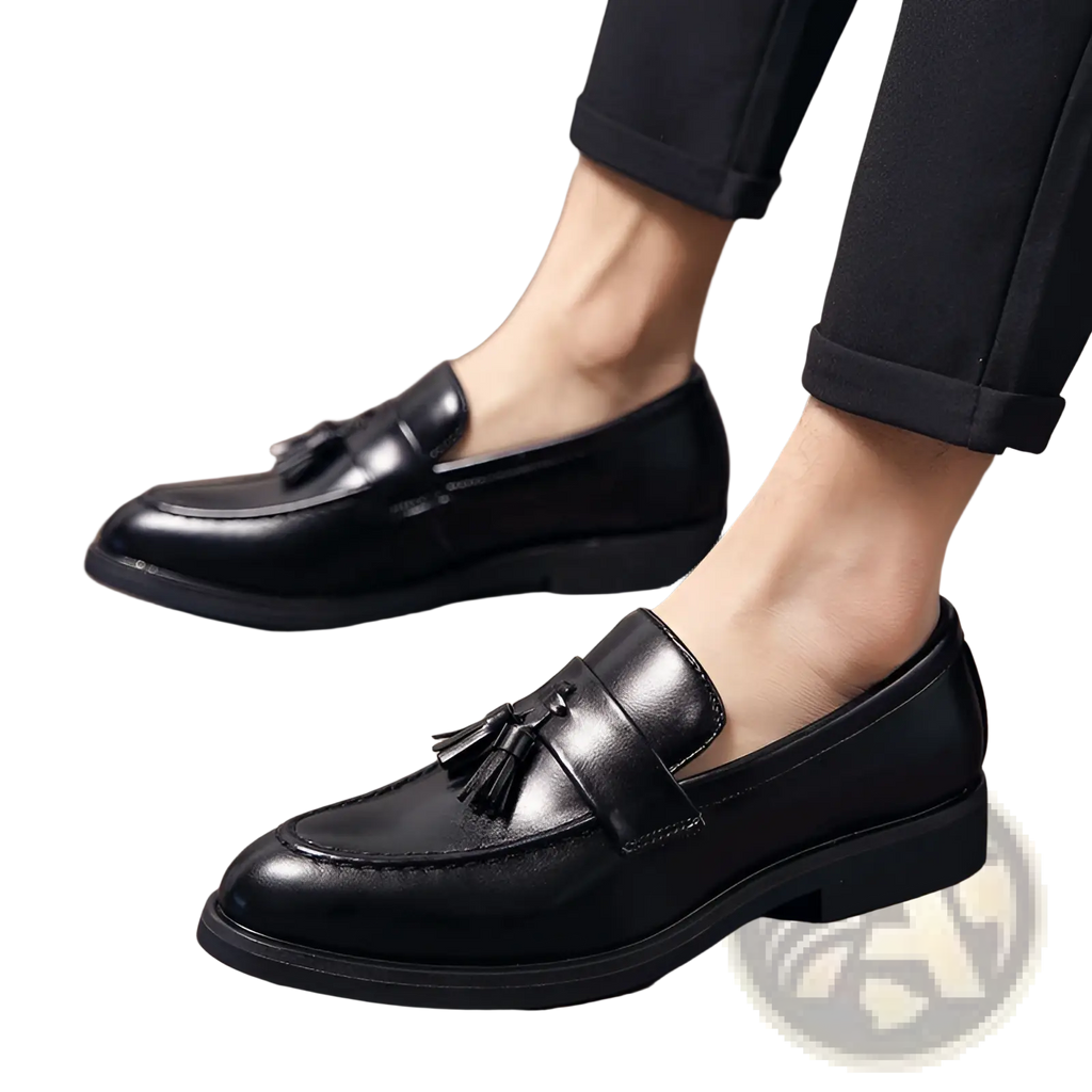 Black leather tassel loafers for men with polished finish and low heel for formal and casual wear