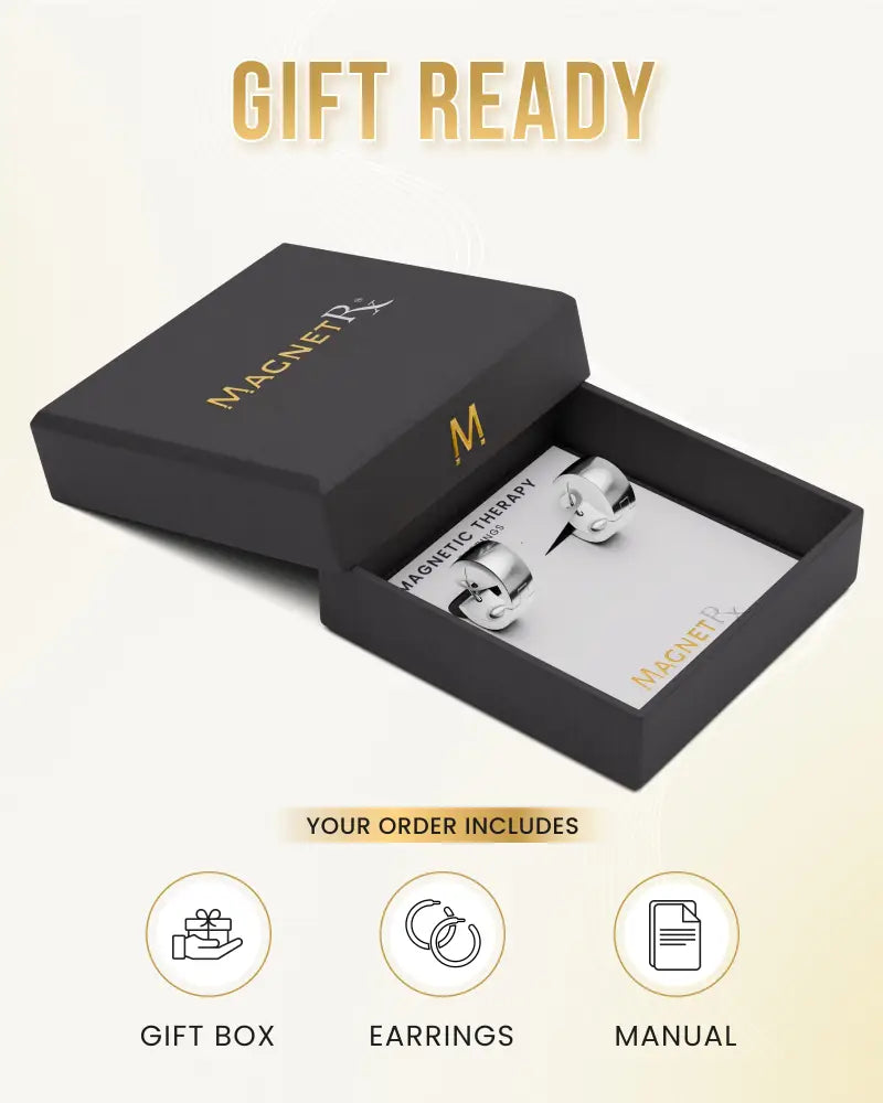Polished silver magnetic neodymium therapy hoop earrings displayed in a sleek black gift box