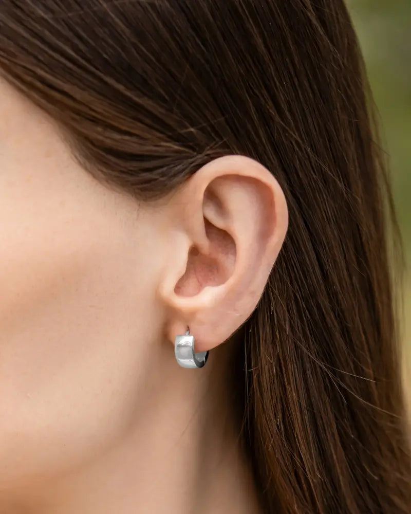 Silver-toned minimalist hoop earring with a sleek modern design from polished silver magnetic neodymium therapy hoop earrings