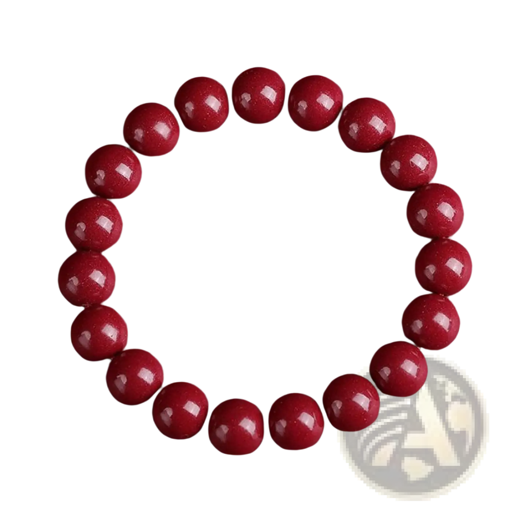 Polished red cinnabar bead bracelet featuring smooth glossy spherical beads arranged in a circular pattern
