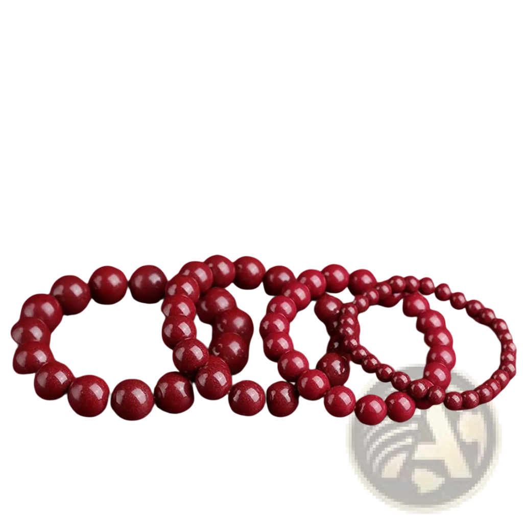 Set of three polished red cinnabar spherical bead bracelets with smooth finish and natural wooden texture