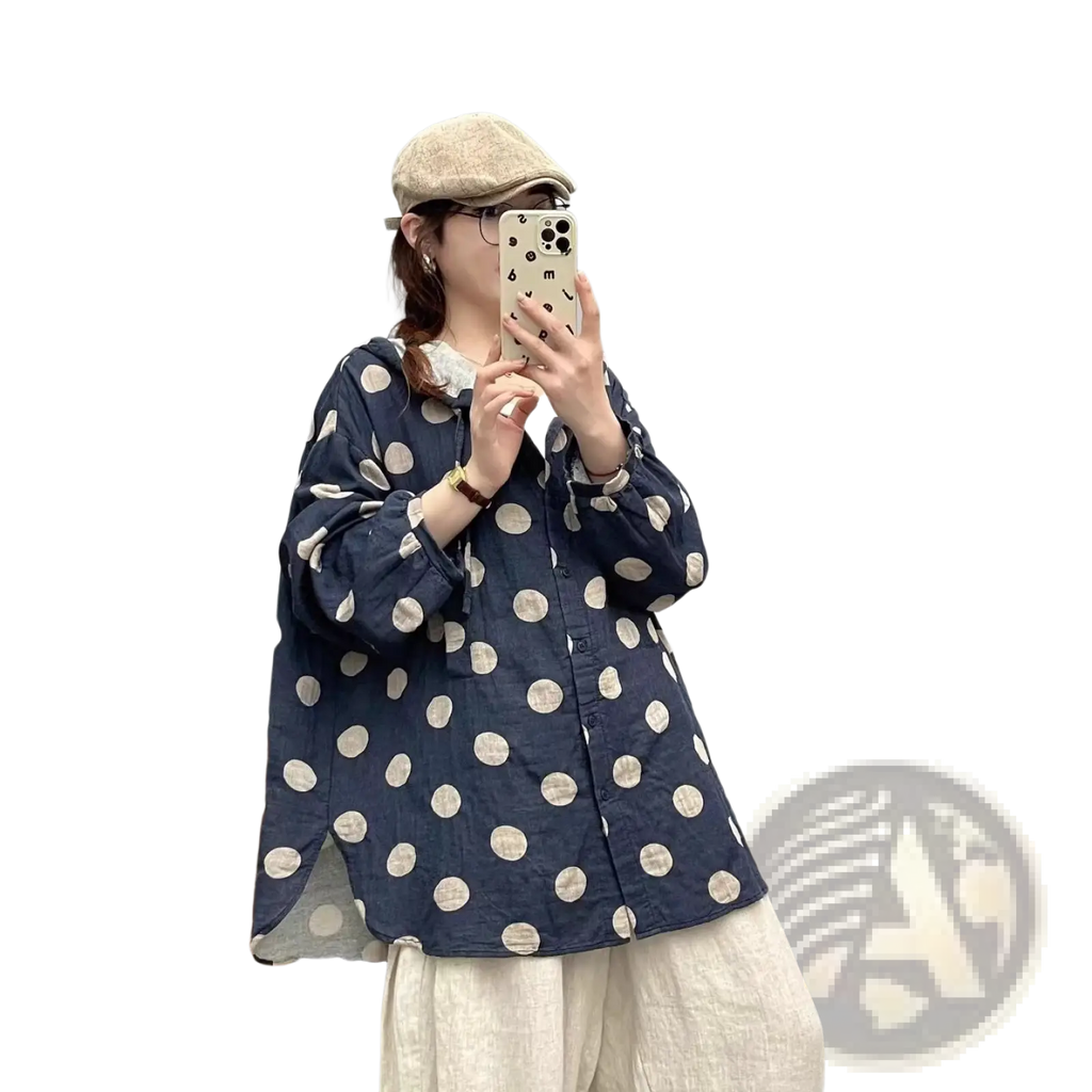 Polka dot cardigan hoodie in navy blue with large cream polka dots featuring a relaxed button-up blouse style