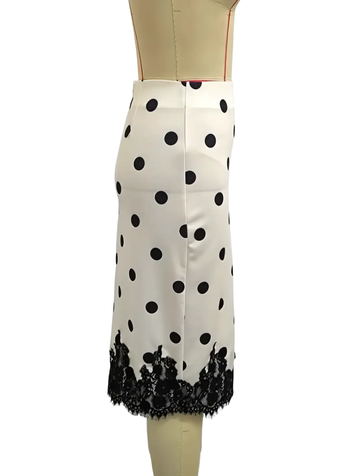 A white polka dot midi skirt with black lace trim at the hem combining elegance and classic style