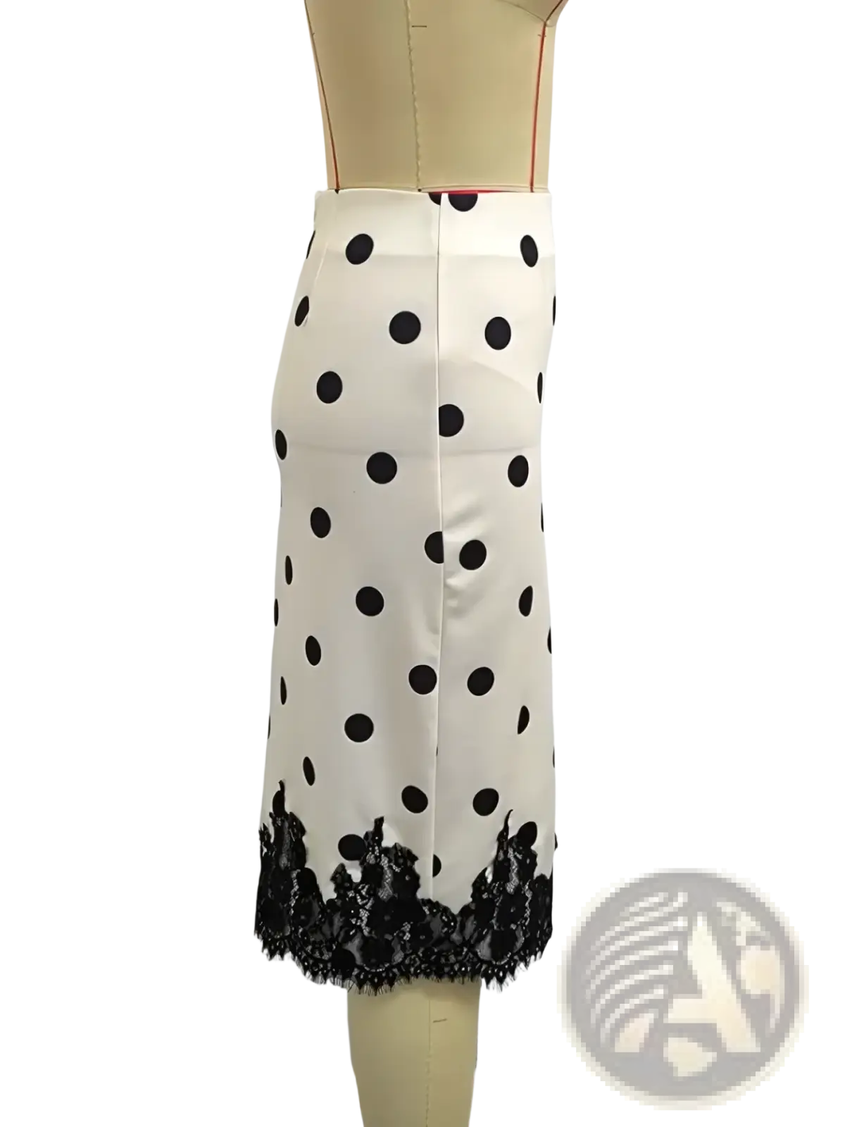 A white polka dot midi skirt with black lace trim at the hem combining elegance and classic style