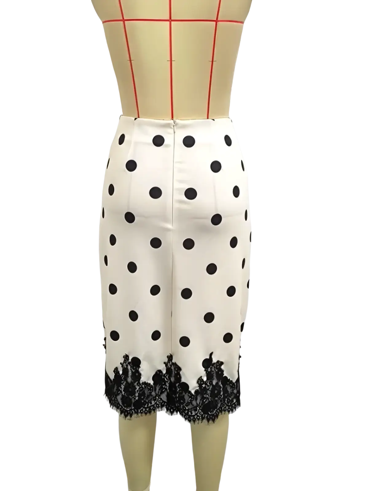 A white midi pencil skirt with black polka dots featuring a black lace trim at the hem