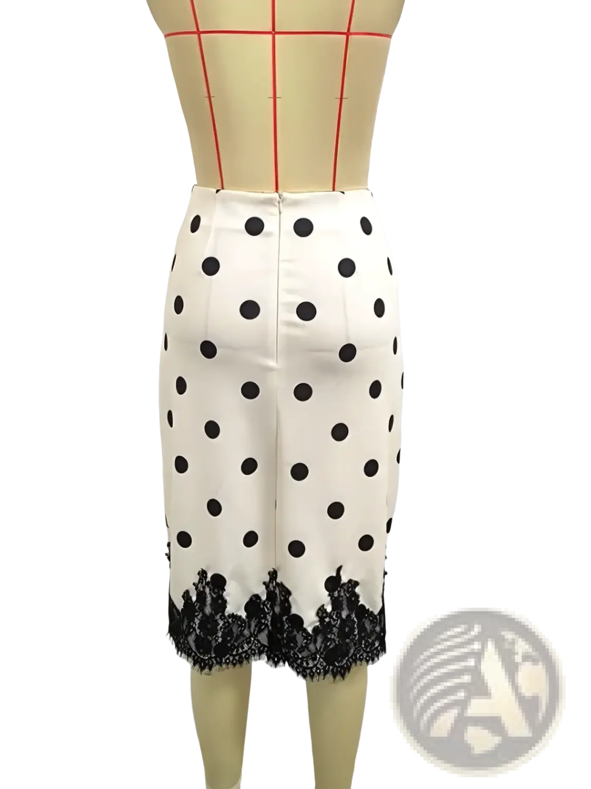 A white midi pencil skirt with black polka dots featuring a black lace trim at the hem