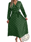 A green polka-dot midi dress with long sleeves and a pleated skirt featuring a v neck design