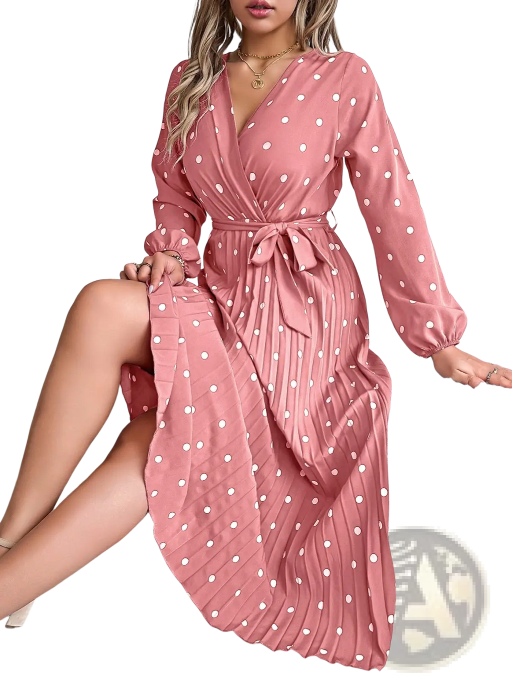 A flowing pink polka dot pleated v neck maxi dress with long sleeves and a self-tie belt