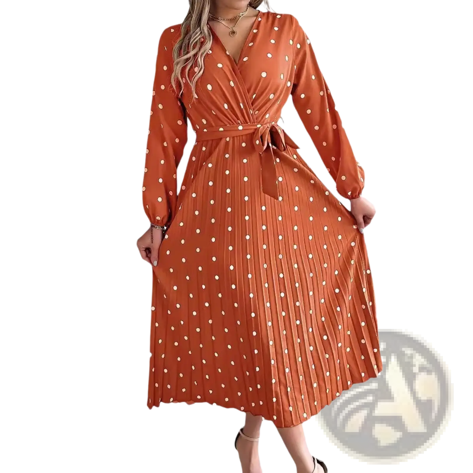 A rust-orange polka dot pleated v neck long sleeve maxi dress with a wrap design and self-tie belt