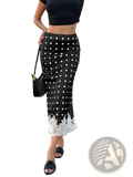 Black satin midi skirt with white polka dots and delicate lace trim at the hem perfect for elegant occasions