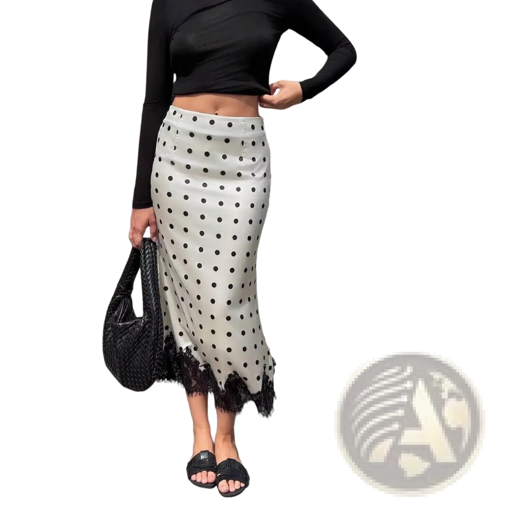 A white satin polka dot midi skirt with black dots and lace trim at the hem for elegant occasions