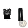 Black polka dot mesh top with cowl neckline and solid waistband paired with wide-leg trousers and studded belt
