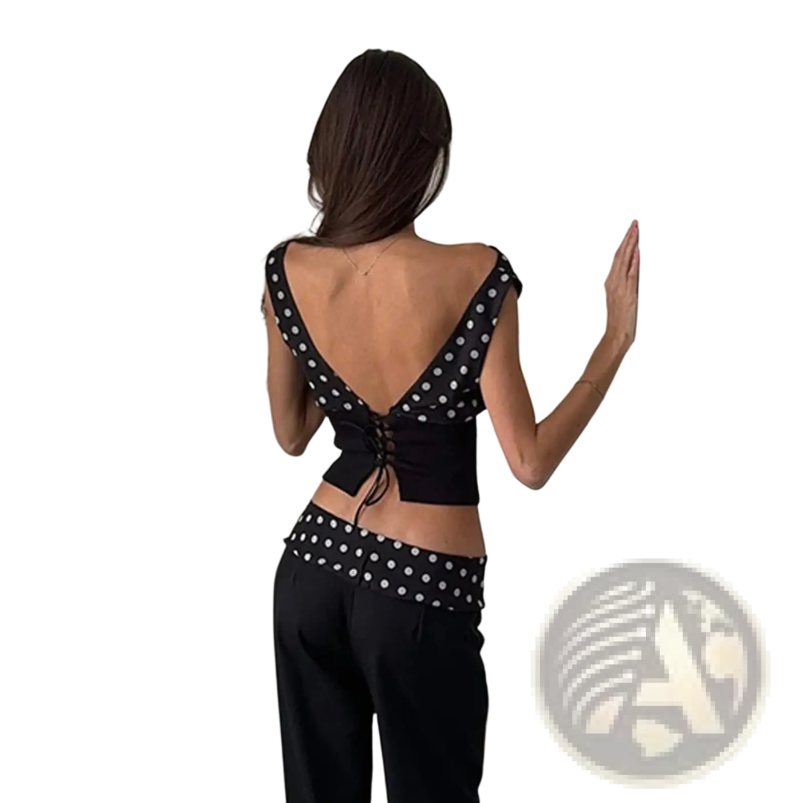 Back view of a black chiffon polka dot one shoulder crop top with a lace up back design